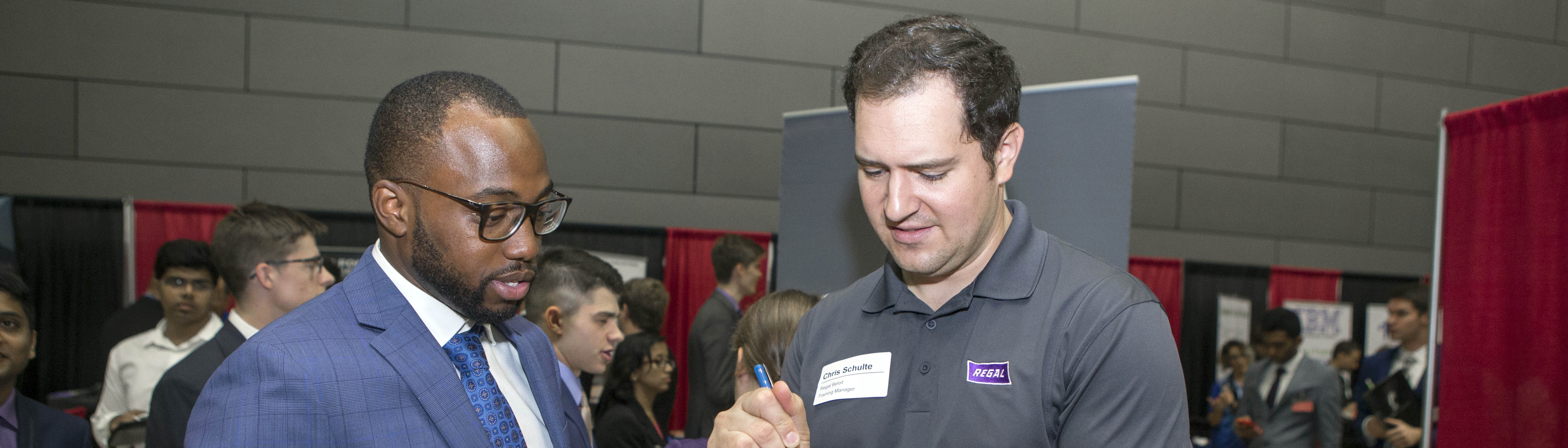 Student talking to an employer at the Career Fair.